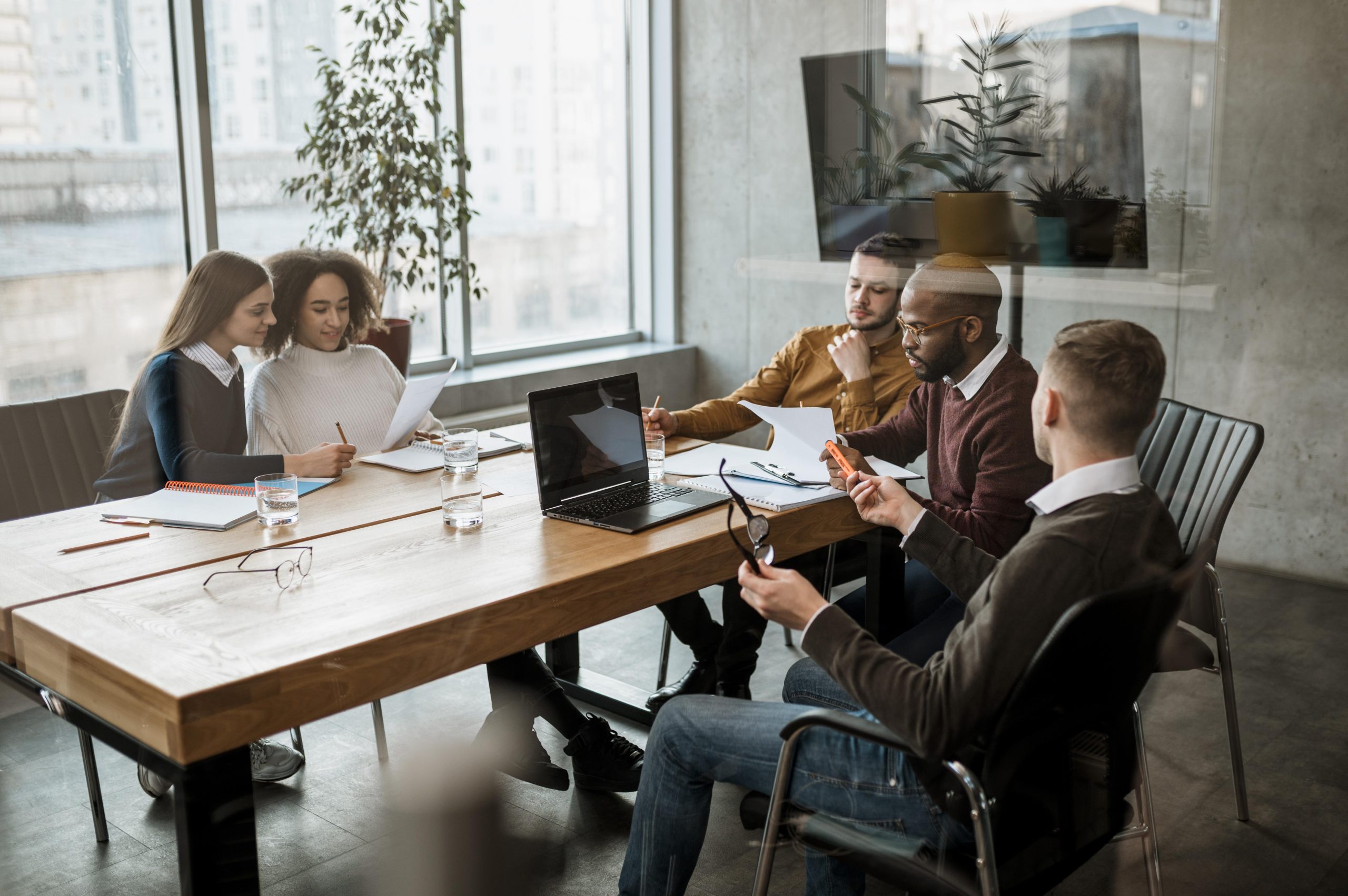 front-view-people-having-meeting-office front-view-people-having-meeting-office